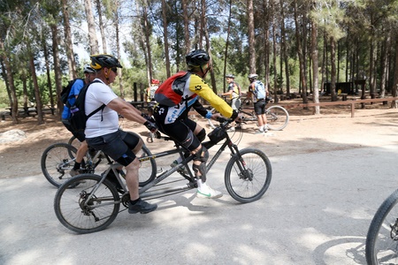 Sighted and blind cyclists ride in tandem in Ben Shemen Forest on Blind Day 2015. Photo: Ido Rosenthal, KKL-JNF Photo Archive